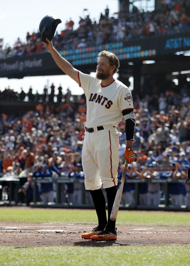 The San Francisco Giants' Hunter Pence leads the team in a cheer during the  celebration in the locker room following a series-clinching 6-3 win in Game  5 of the National League Championship