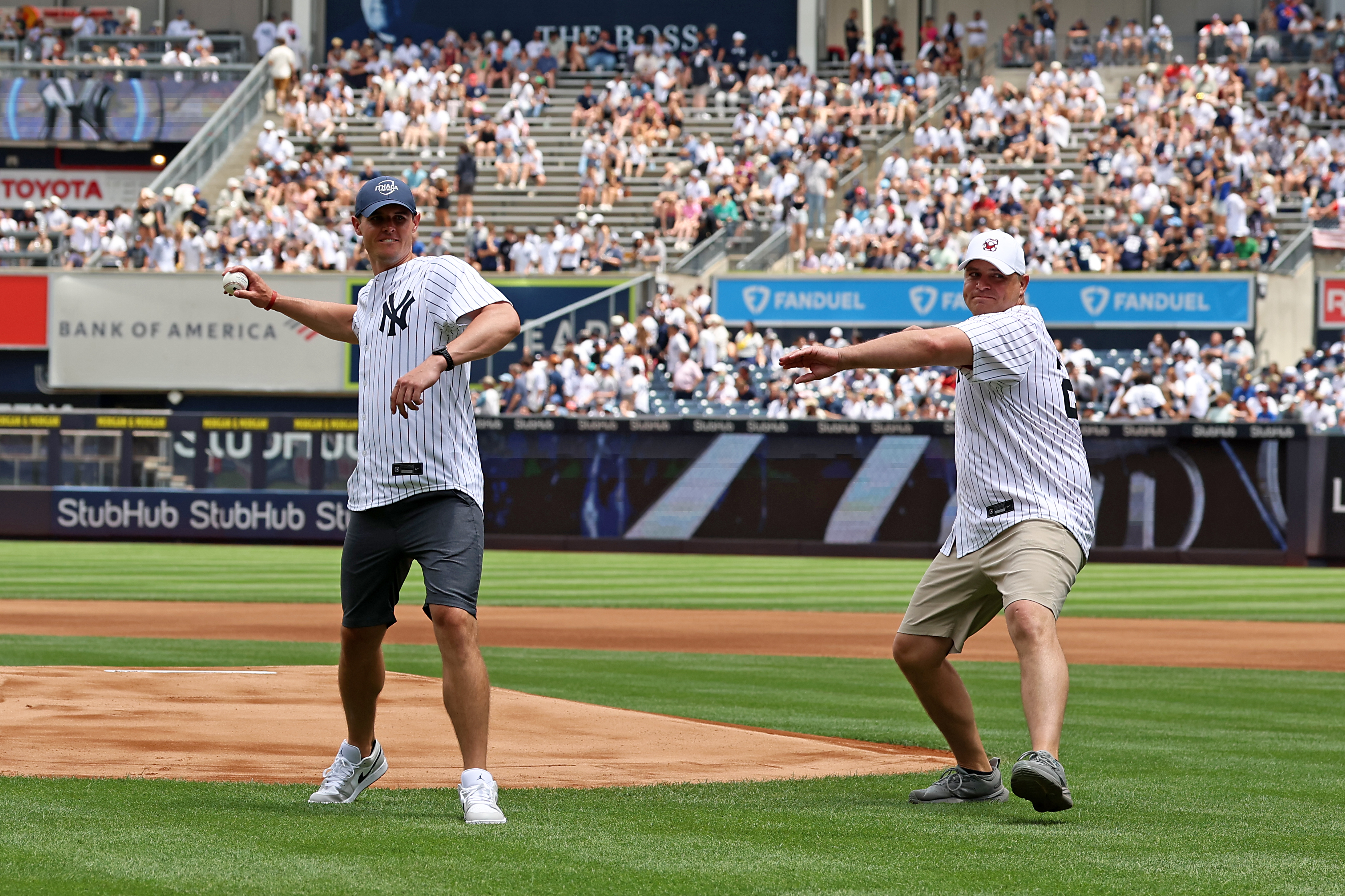 While they’ll be on opposite sidelines during the 67th Cortaca Jug showdown on Nov. 14, Ithaca’s Maguire (left) and Cortland’s Blumenauer spent some time together during a visit to Yankee Stadium in June. The two head coaches threw ceremonial first pitches before the Yankees faced the Red Sox, a fitting backdrop from which to preview one of college football’s most intense rivalries. (Photo Credit: New York Yankees)