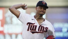 An American professional baseball player, Chris Archer holds a net