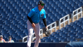 Miami Marlins' Peyton Burdick, right, high-fives Jordan Groshans