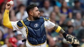 Seattle Mariners' Omar Narvaez (22) is greeted by manager Scott