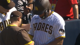 Jorge Posada puts his hand on the back of Yogi Bera at Yankee