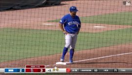 Cheslor Cuthbert of the Kansas City Royals warms his hands in