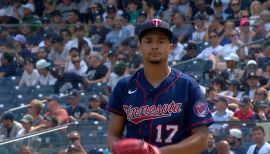 An American professional baseball player, Chris Archer holds a net