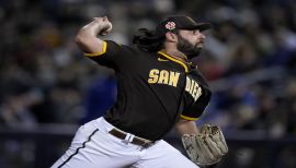 Nabil Crismatt of the Arizona Diamondbacks waves to his old