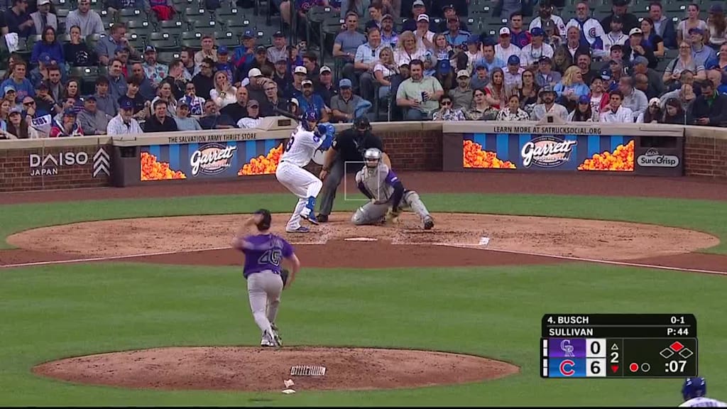 Michael Busch singles on a fly ball to right fielder Tyler Freeman