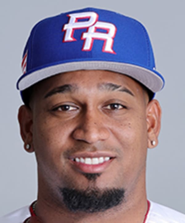 Puerto Rico pitcher Edwin Diaz (39) is being helped by team pitching coach  Ricky Bones and medical staff after the the Pool D game against Dominican  Republic at the World Baseball Classic