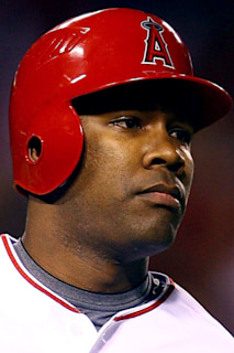 Anaheim, CA. 4th Apr, 2016. Former Los Angeles Angels player Garrett  Anderson #16 throws out the first pitch before the Opening Night Major  League Baseball game between the Chicago Cubs and the