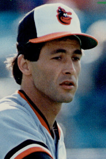 Baltimore Orioles' pitcher Mike Boddicker, right, is congratulated