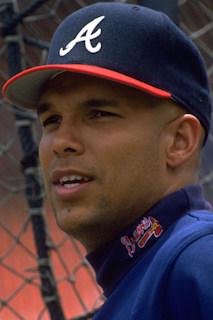 Former Atlanta Braves player David Justice, right, hugs Braves