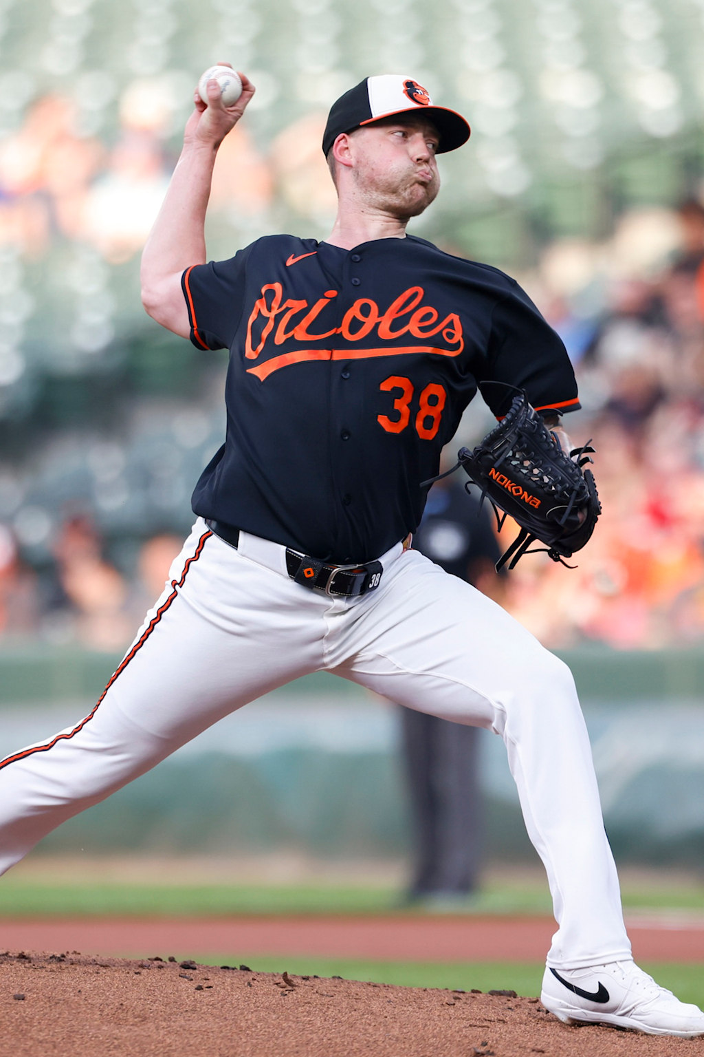 Baltimore Orioles right-hander Kyle Bradish finishing his delivery, the starter tasked with ending Boston's 14-game winning streak at Fenway Park