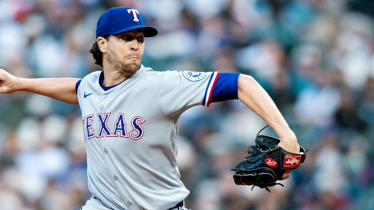 Texas Rangers starting pitcher Jacob deGrom delivering a pitch in action