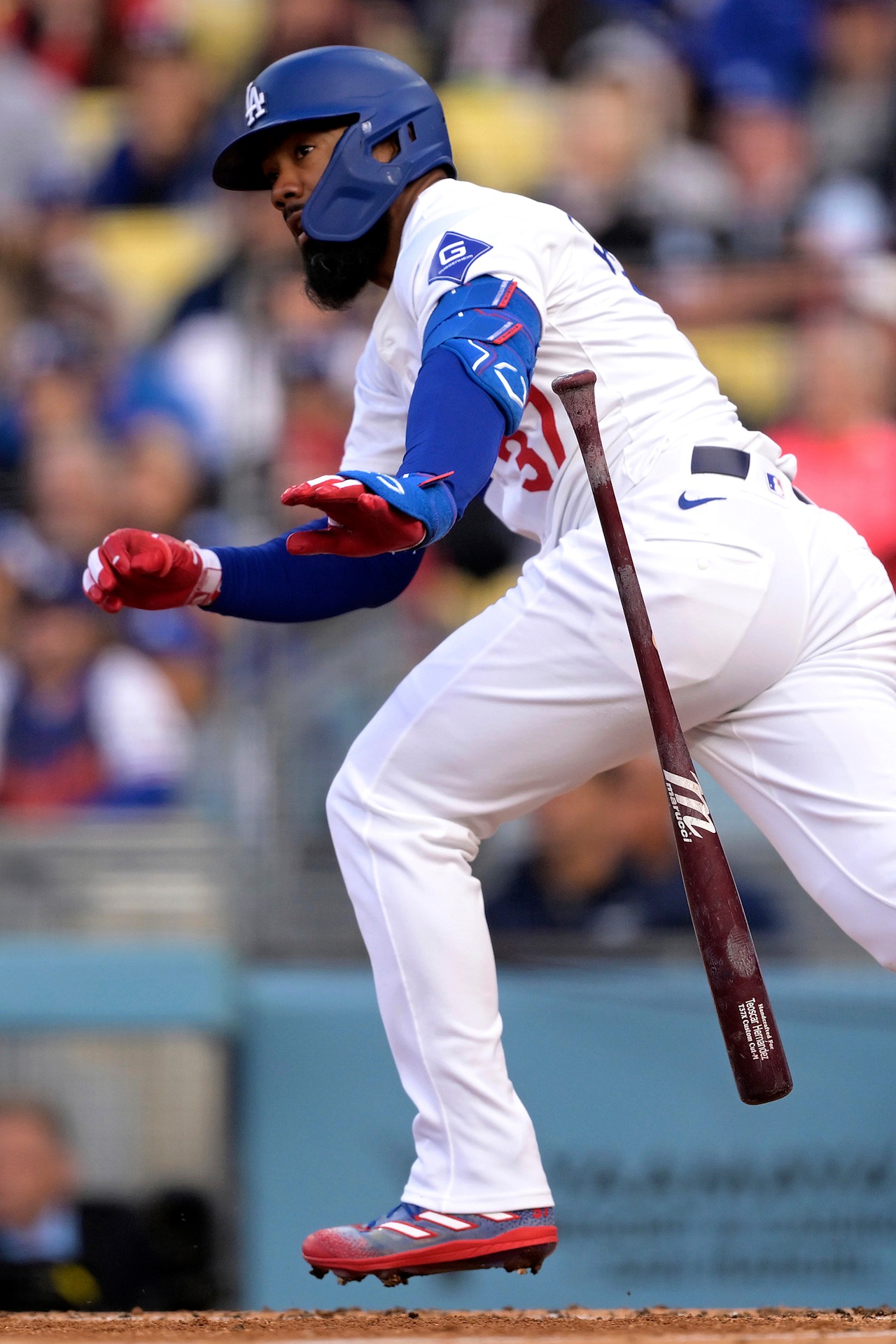 Los Angeles Dodgers outfielder Teoscar Hernandez following through on a swing at Dodger Stadium, host of Saturday night's marquee game against Milwaukee