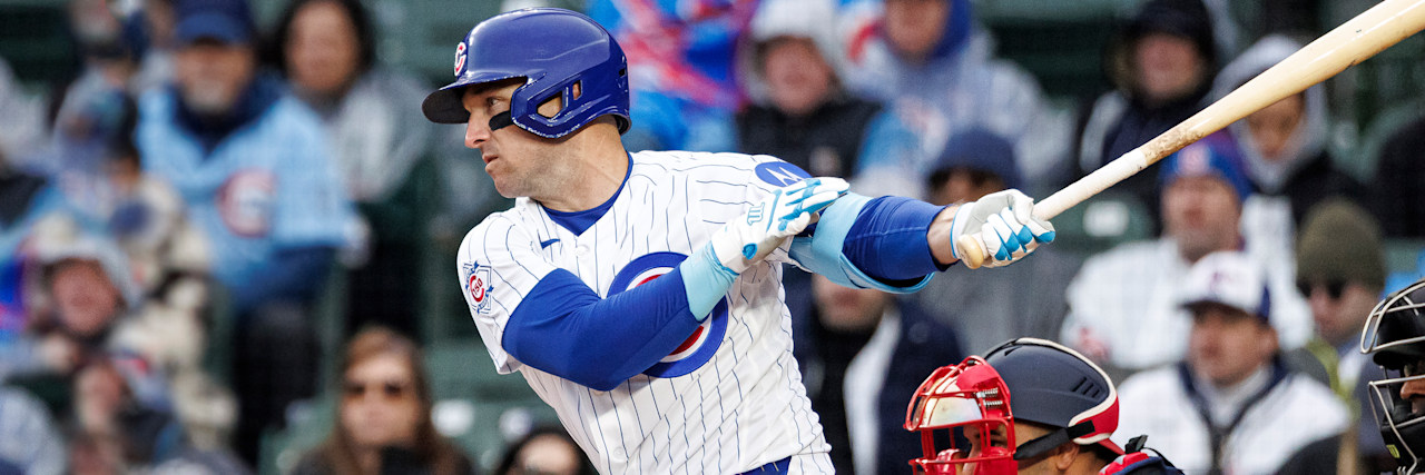 Chicago Cubs third baseman Alex Bregman finishing a swing at Wrigley Field