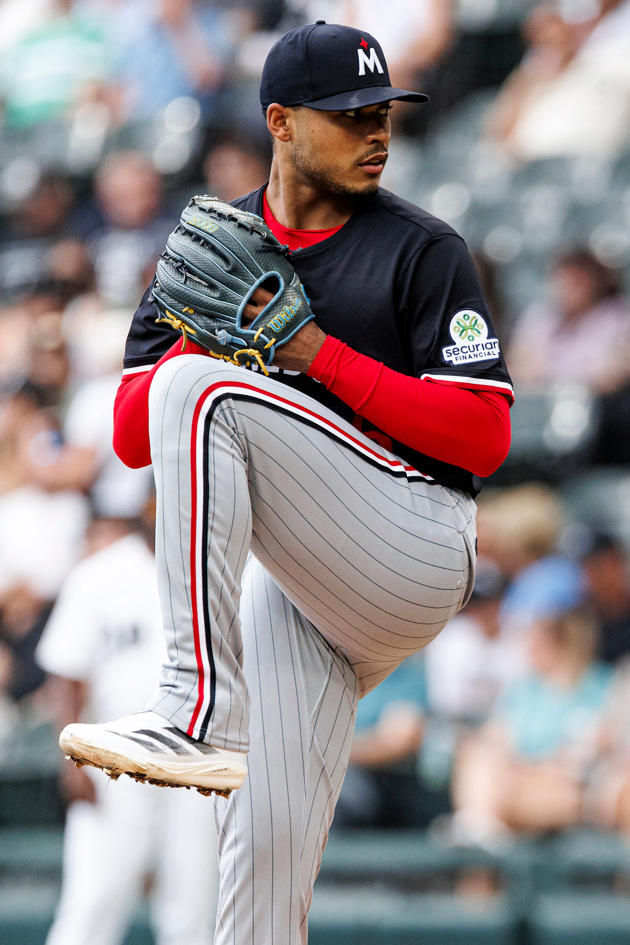 Minnesota Twins right-hander Taj Bradley delivering a pitch, the starter for the Field of Dreams game against the Phillies