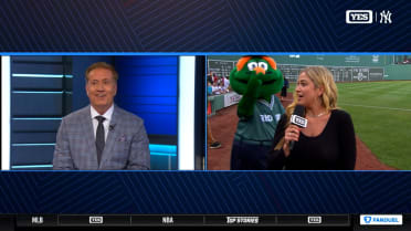 Wally the Green Monster visits Meredith Marakovits prior to Yankees vs. Red Sox