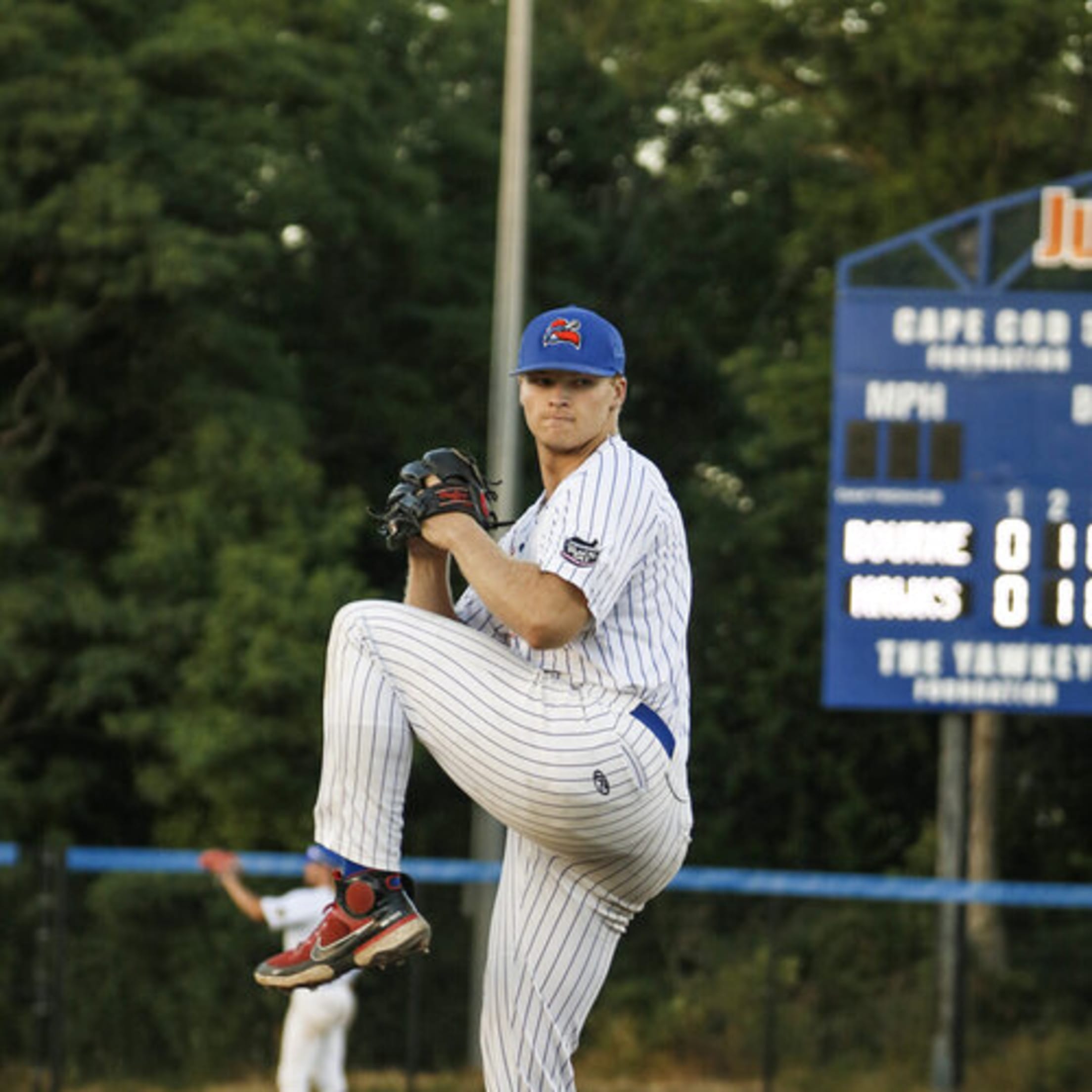A tall righty goes into his windup during a Hyannis home game.