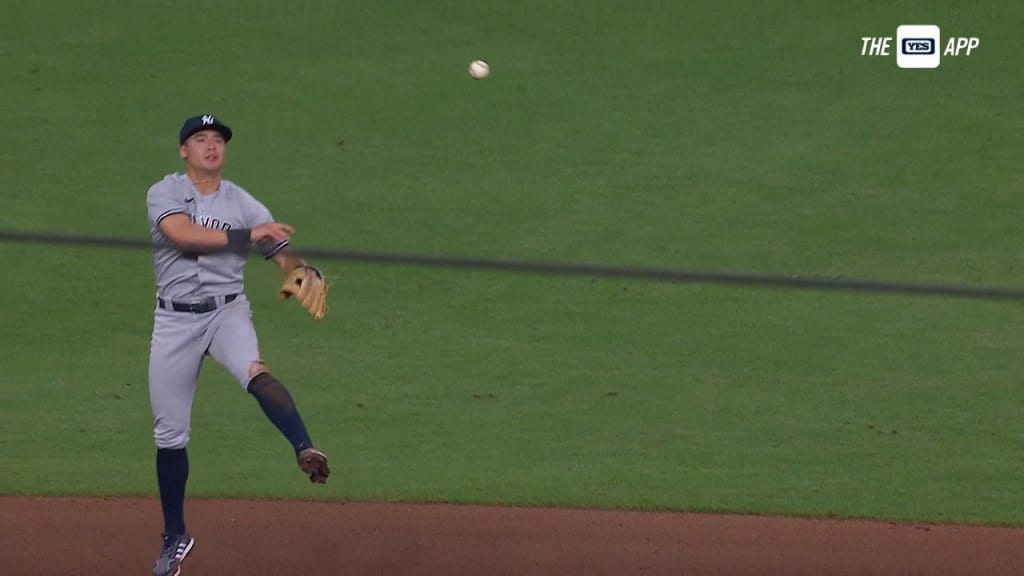 Fan throws shirt at Yankees' Anthony Volpe while running on field